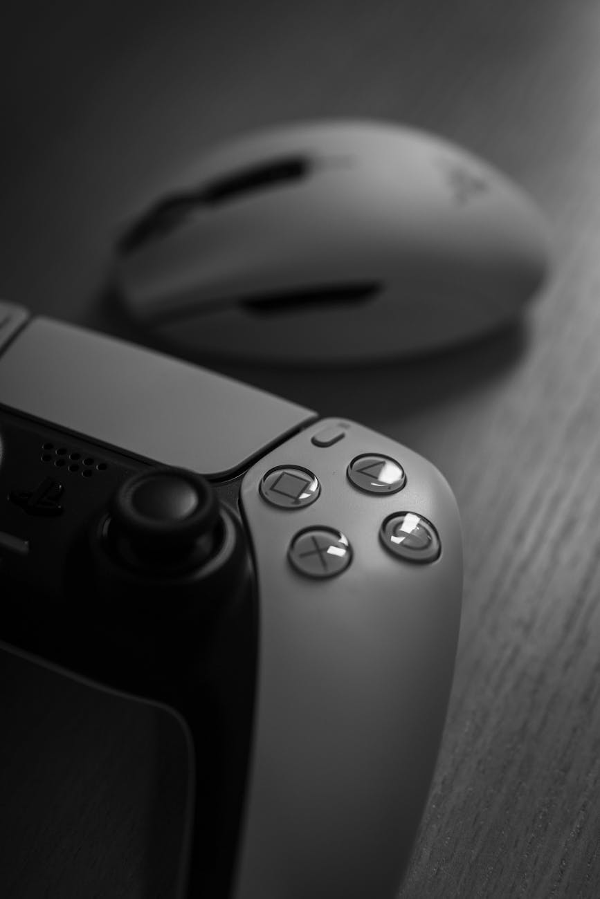 close up of gaming controller and mouse in monochrome
