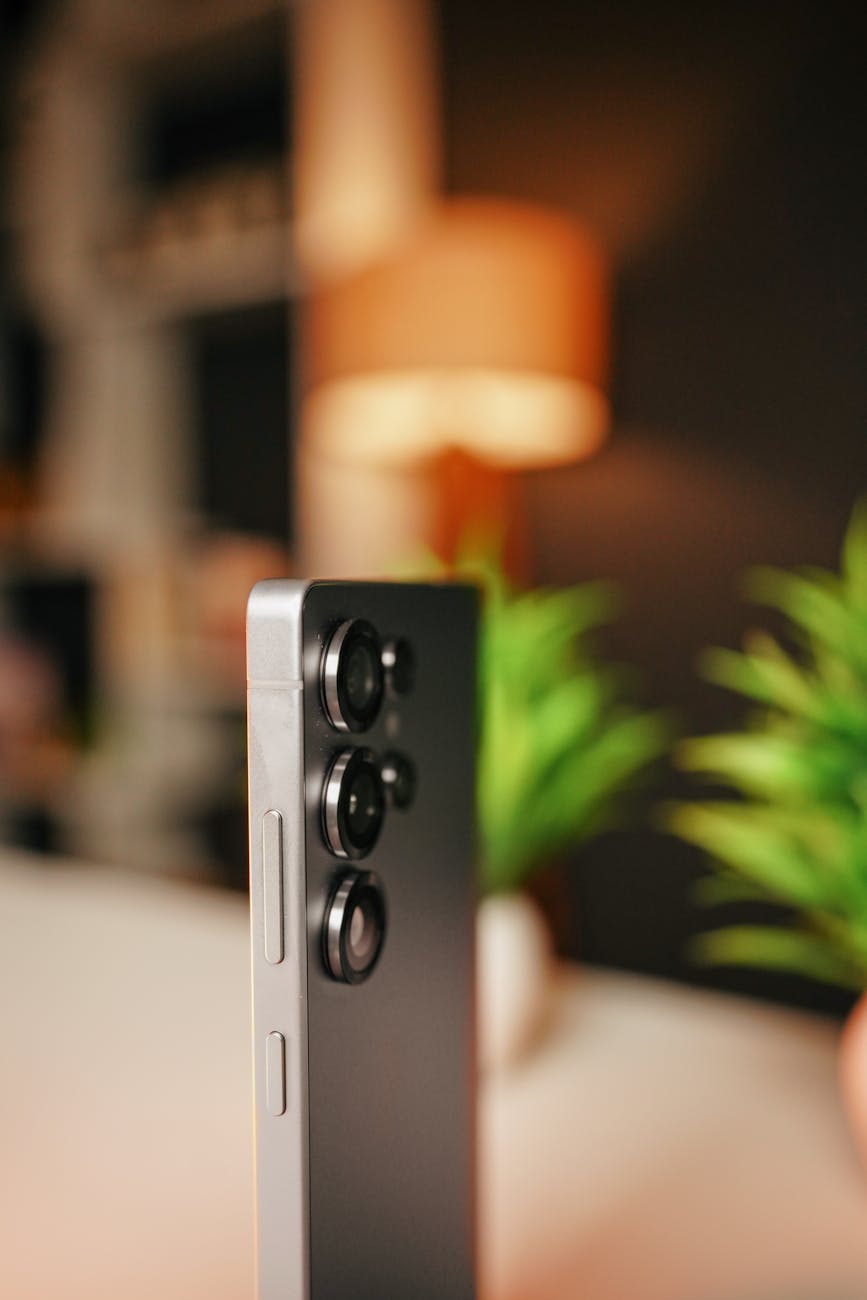 close up of modern smartphone with triple cameras