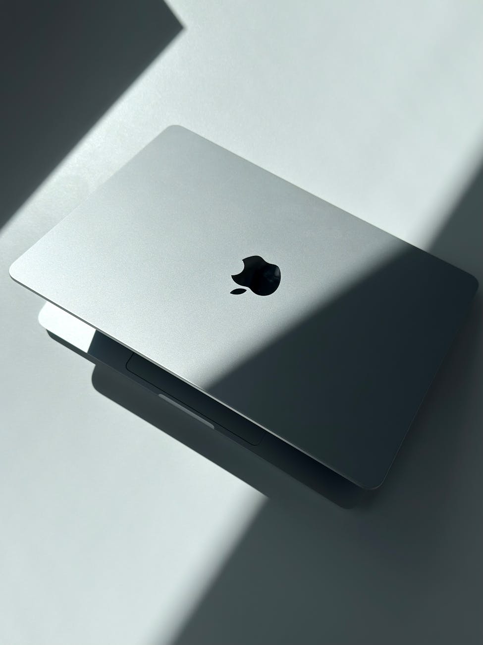 sleek silver laptop in dramatic light