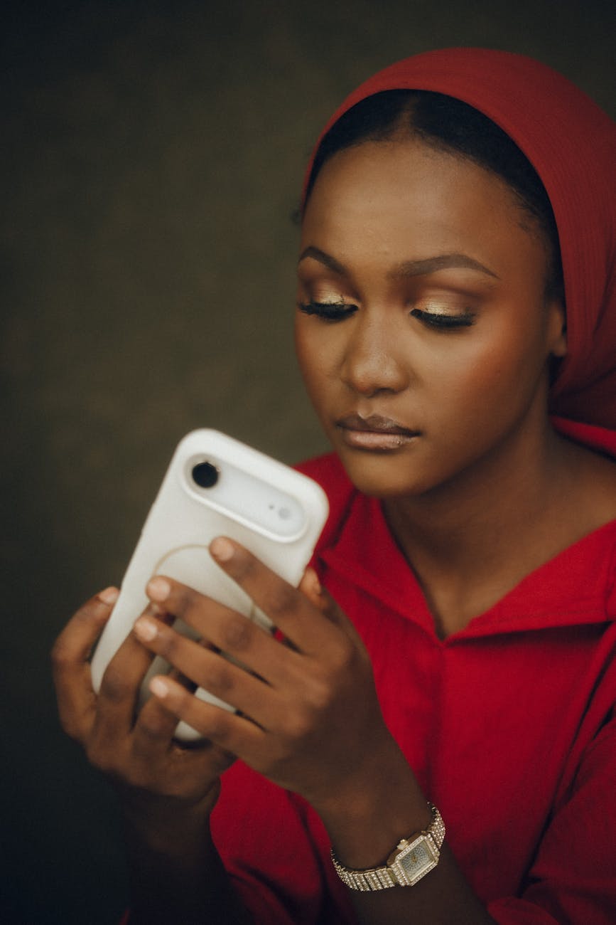 woman in red using smartphone
