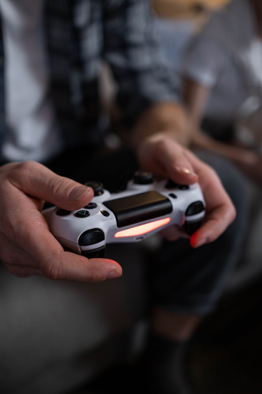 close up shot of a person holding a game controller